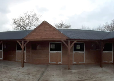 The main feature on this part of a much larger installation is a 1.8m overhang and feature gable in the roof. A wider overhang affords more room in the roof area, resulting in more desirable air quality and a healthier environment for your horses.